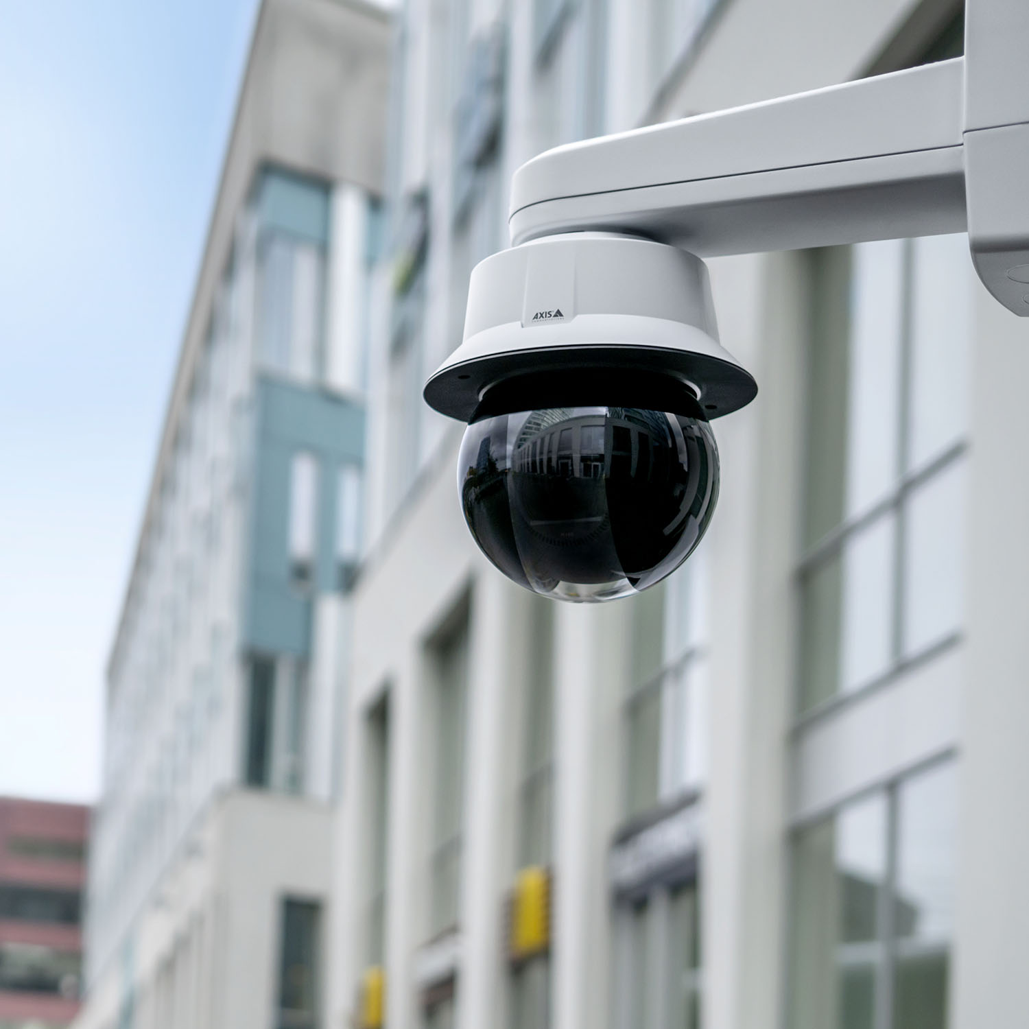 AXIS Q6325-LE PTZ Video Camera on an outdoor wall mount.