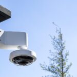 AXIS P3737-PLE Video Camera on an exterior wall mount.