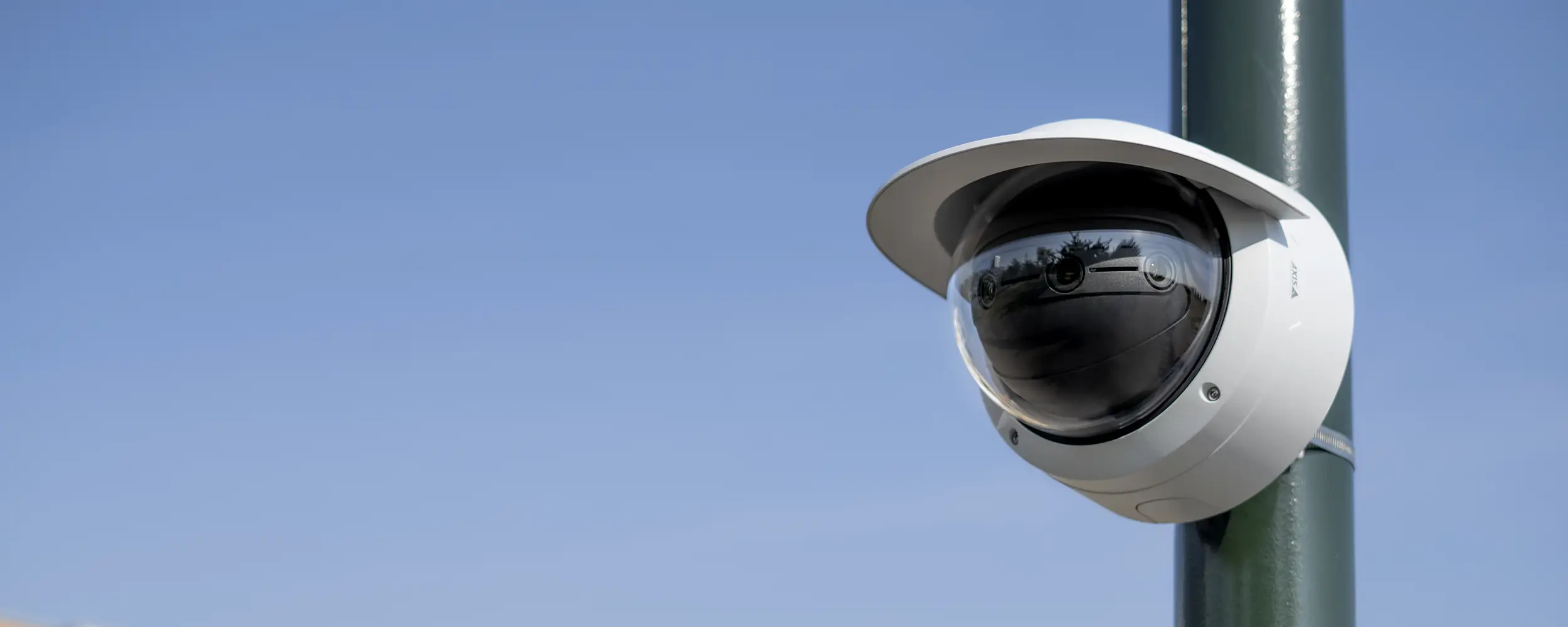 AXIS dome video camera mounted on a pole.